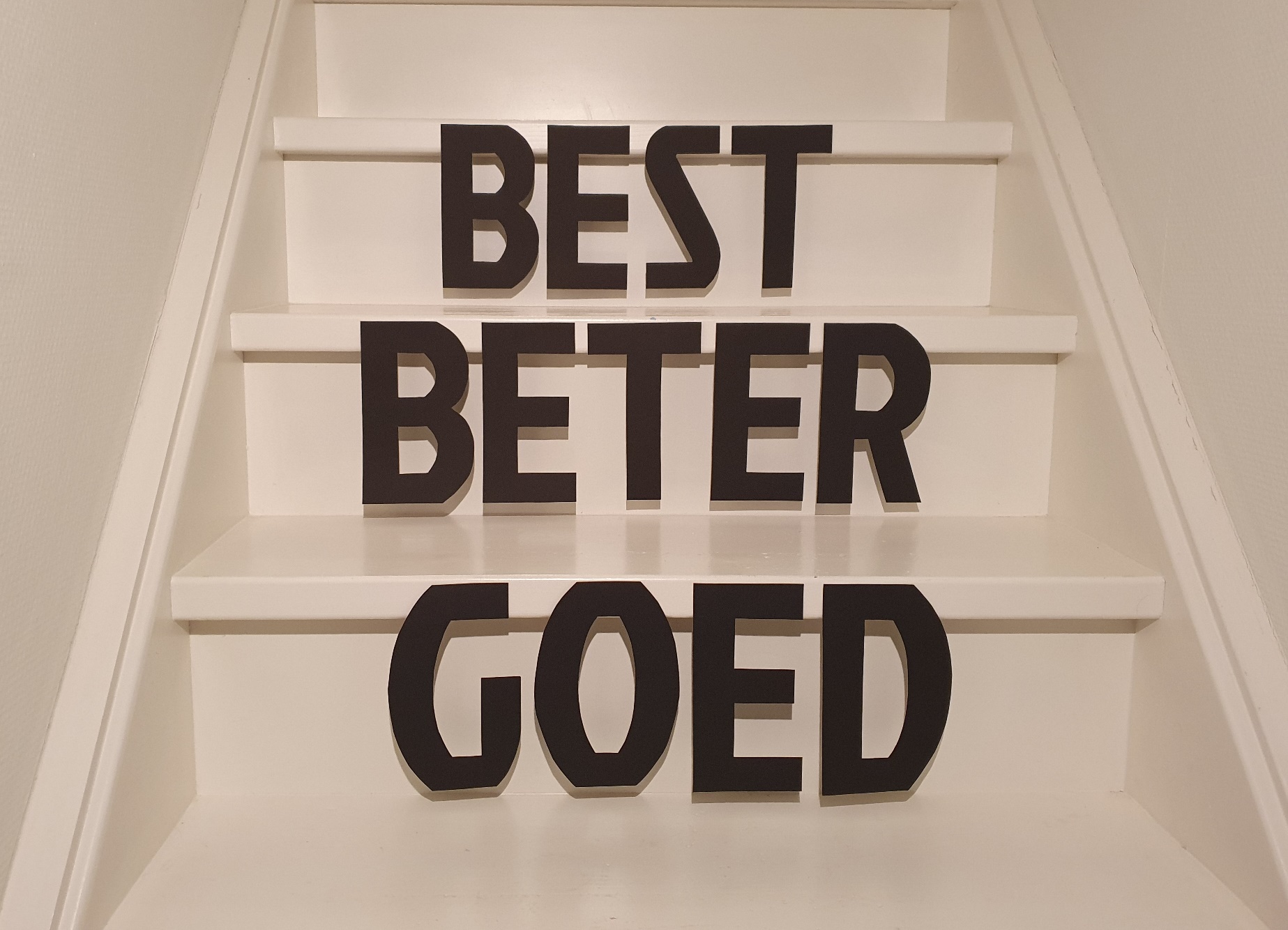 Black letters on a white staircase