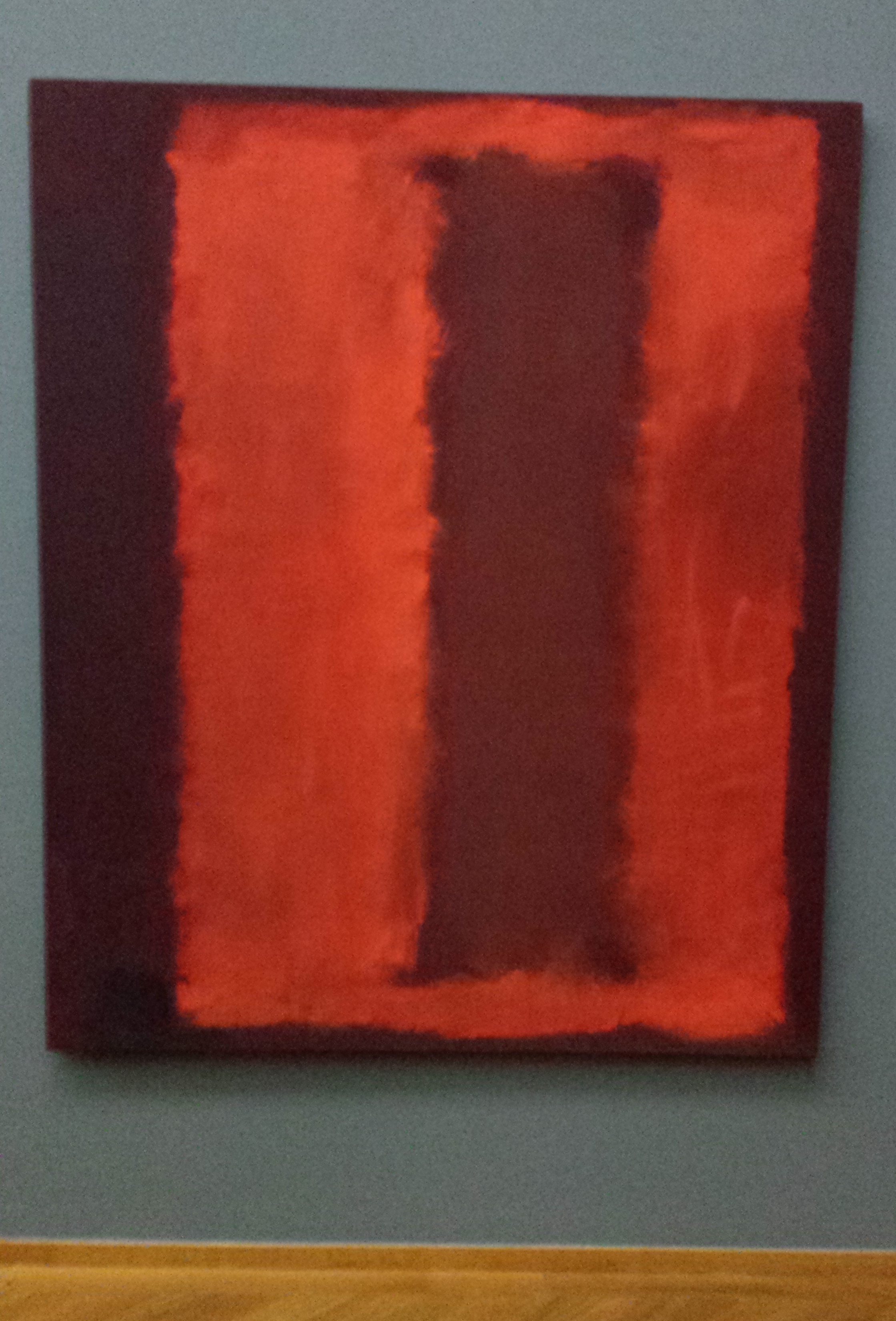 Painting with upright surfaces in red and brown tones